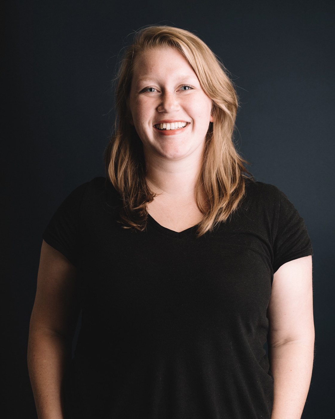 Chez Koop team member smiling in studio – Steinbach Manitoba creative design studio