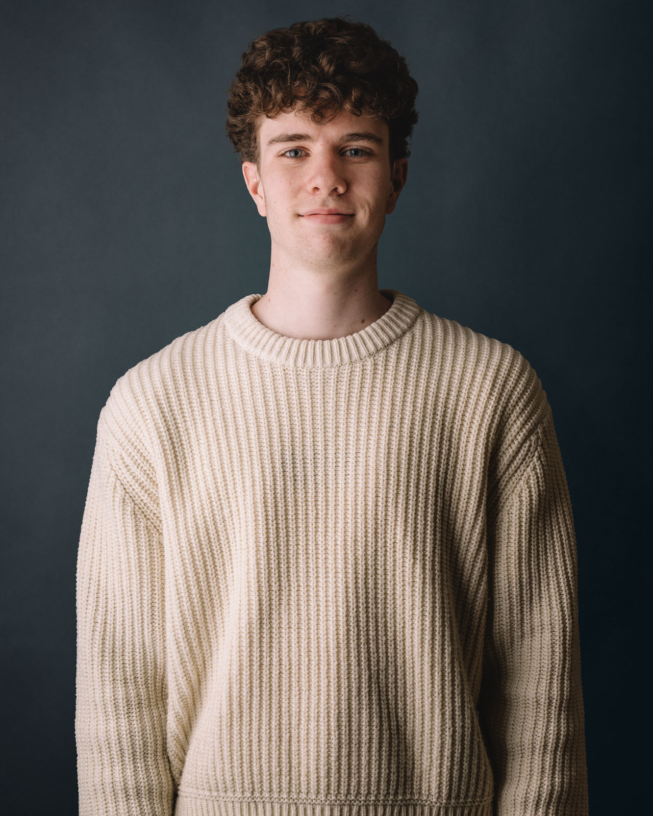 Portrait of a young man in a cozy sweater – Chez Koop, creative studio in Steinbach, Manitoba.