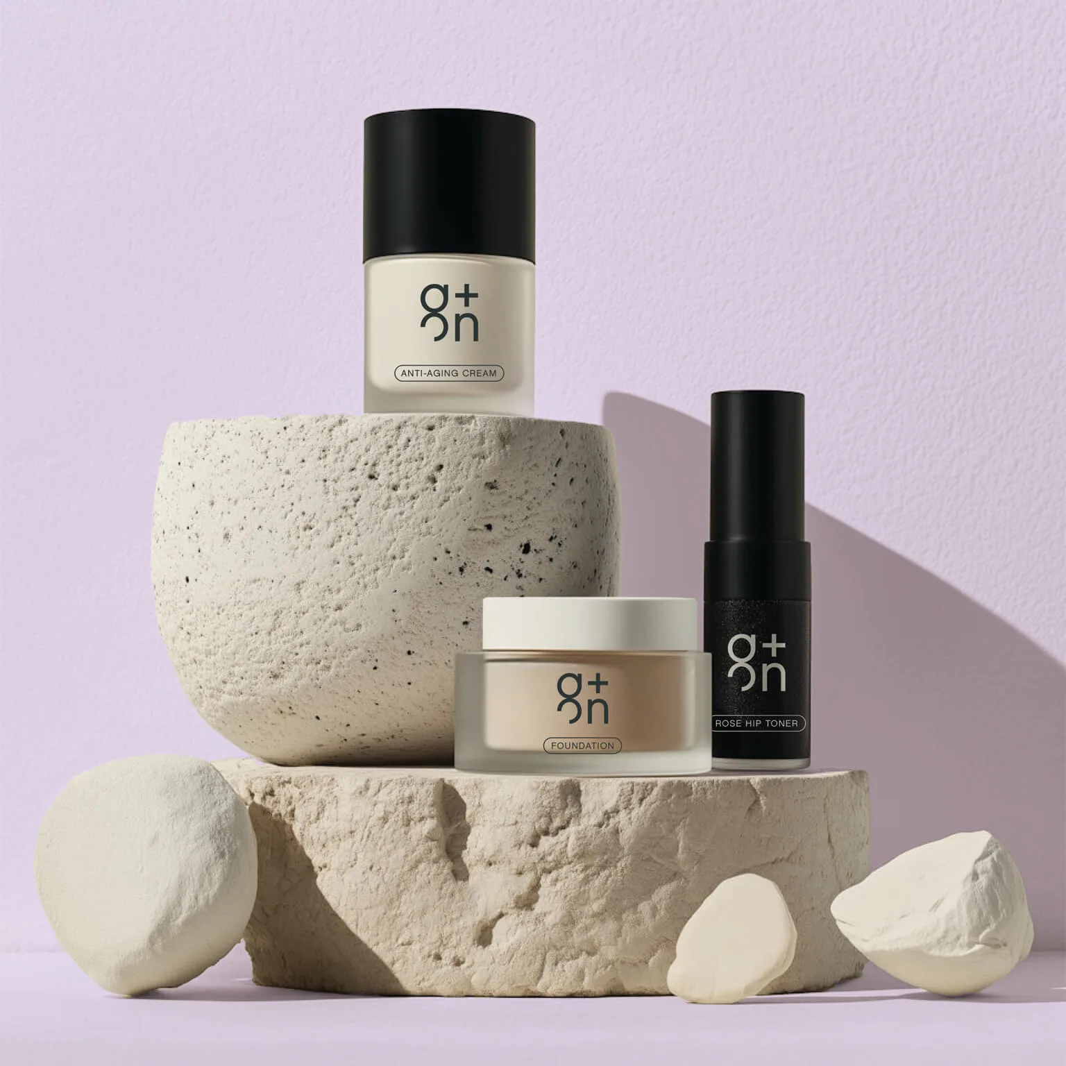 Stylish skincare products displayed on stone pedestal – branding by Chez Koop, Steinbach Manitoba design studio