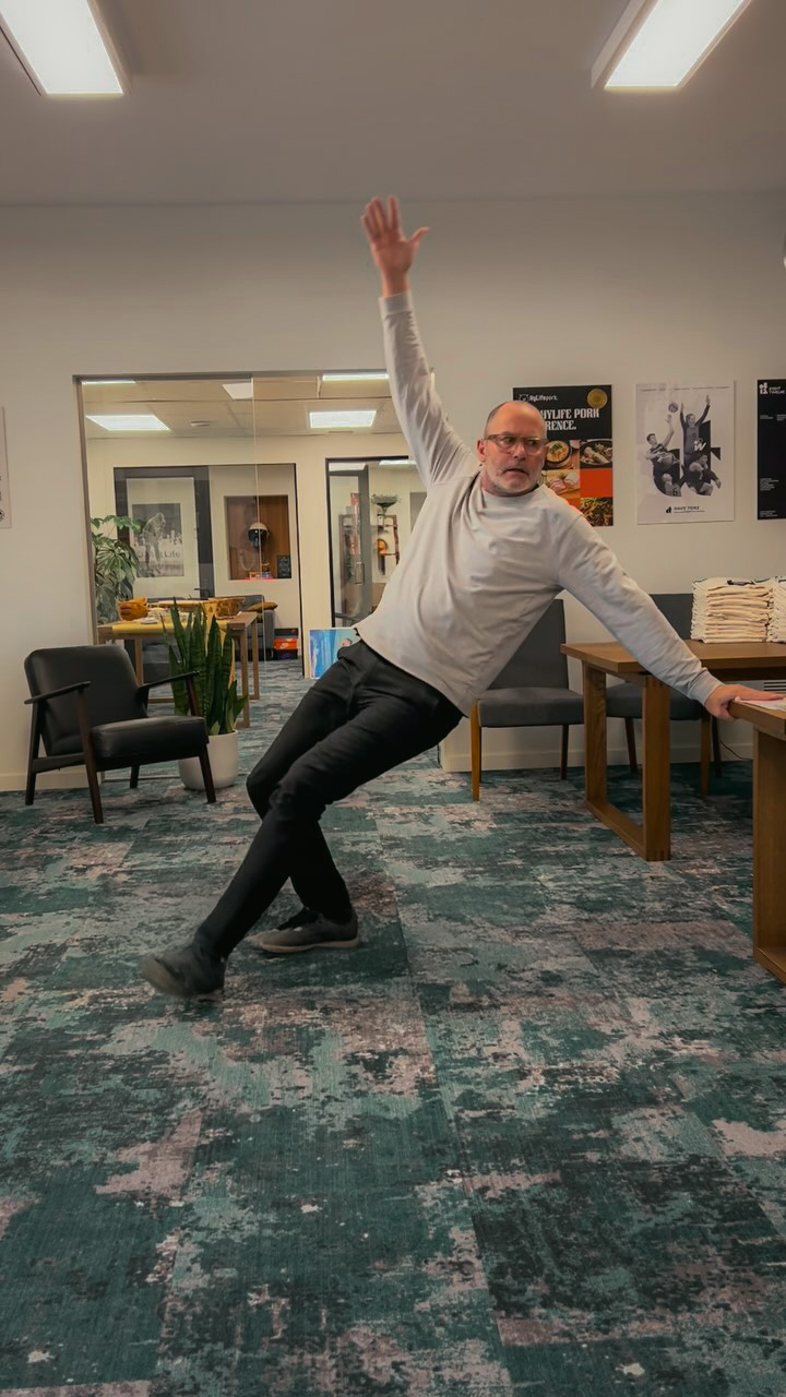 Creative team member at Chez Koop showcasing energy in Steinbach Manitoba design studio environment